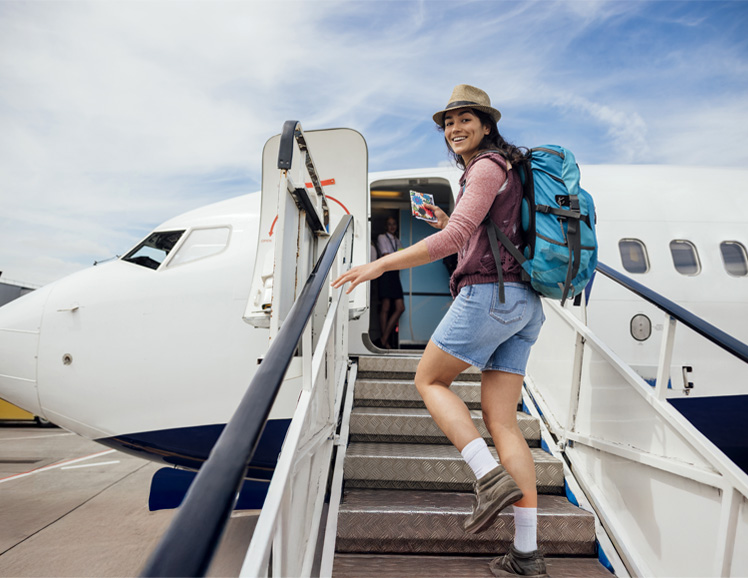 Woman boarding airplane