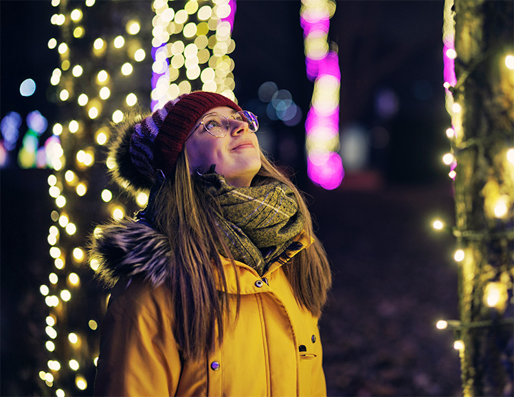 Woman admiring holiday lights